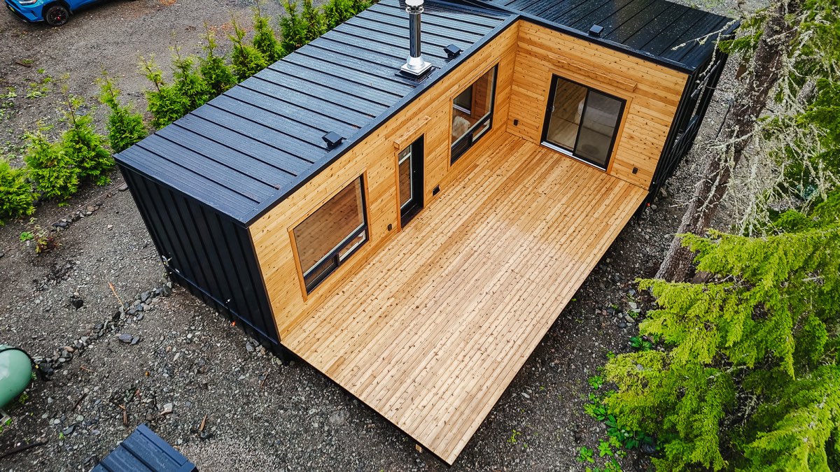 Aerial view of a finished cedar Elk Ridge home with a large deck