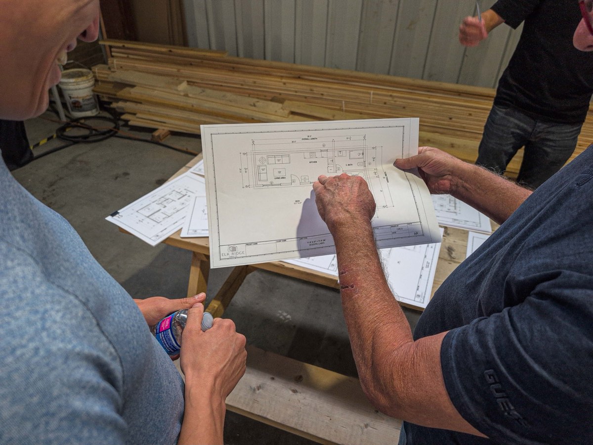 Clients going over their floor plan with the Elk Ridge team in the shop